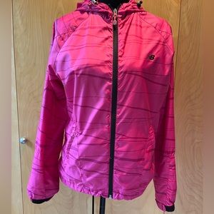 New Balance Women’s Run Light Pack Windbreaker with hood.